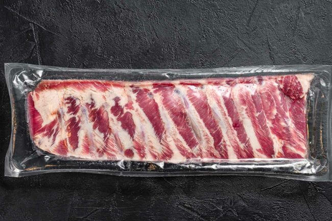 Rack of ribs in clear plastic packaging