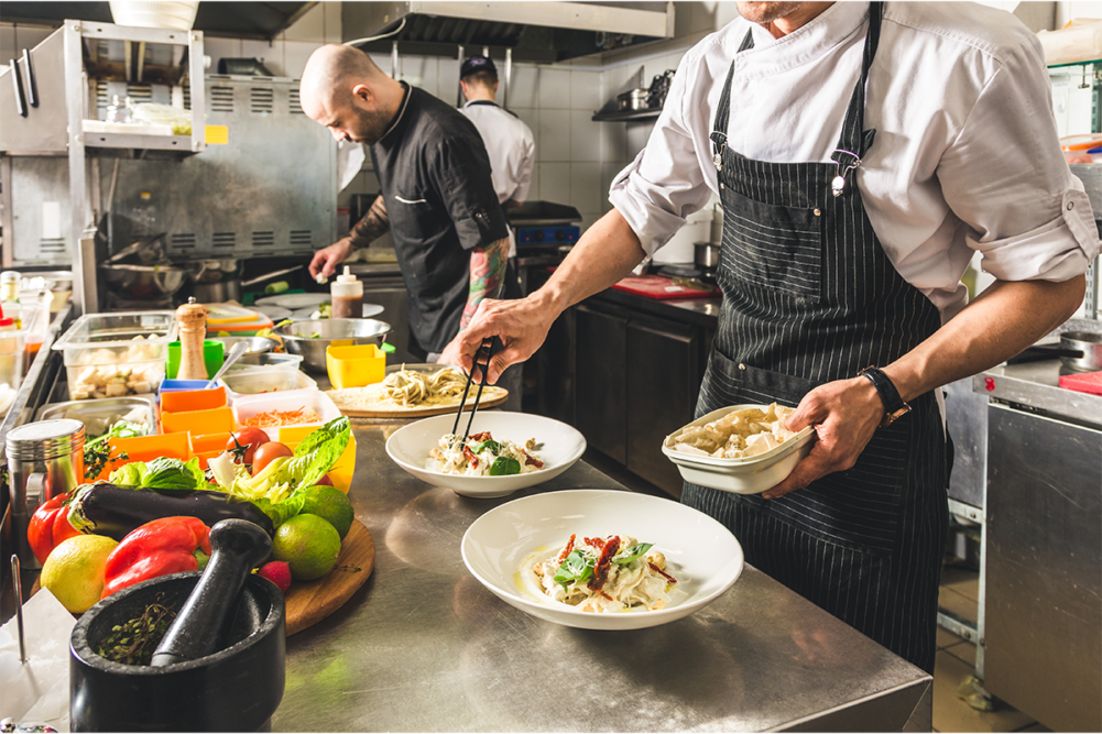 line cooks in restaurant kitchen