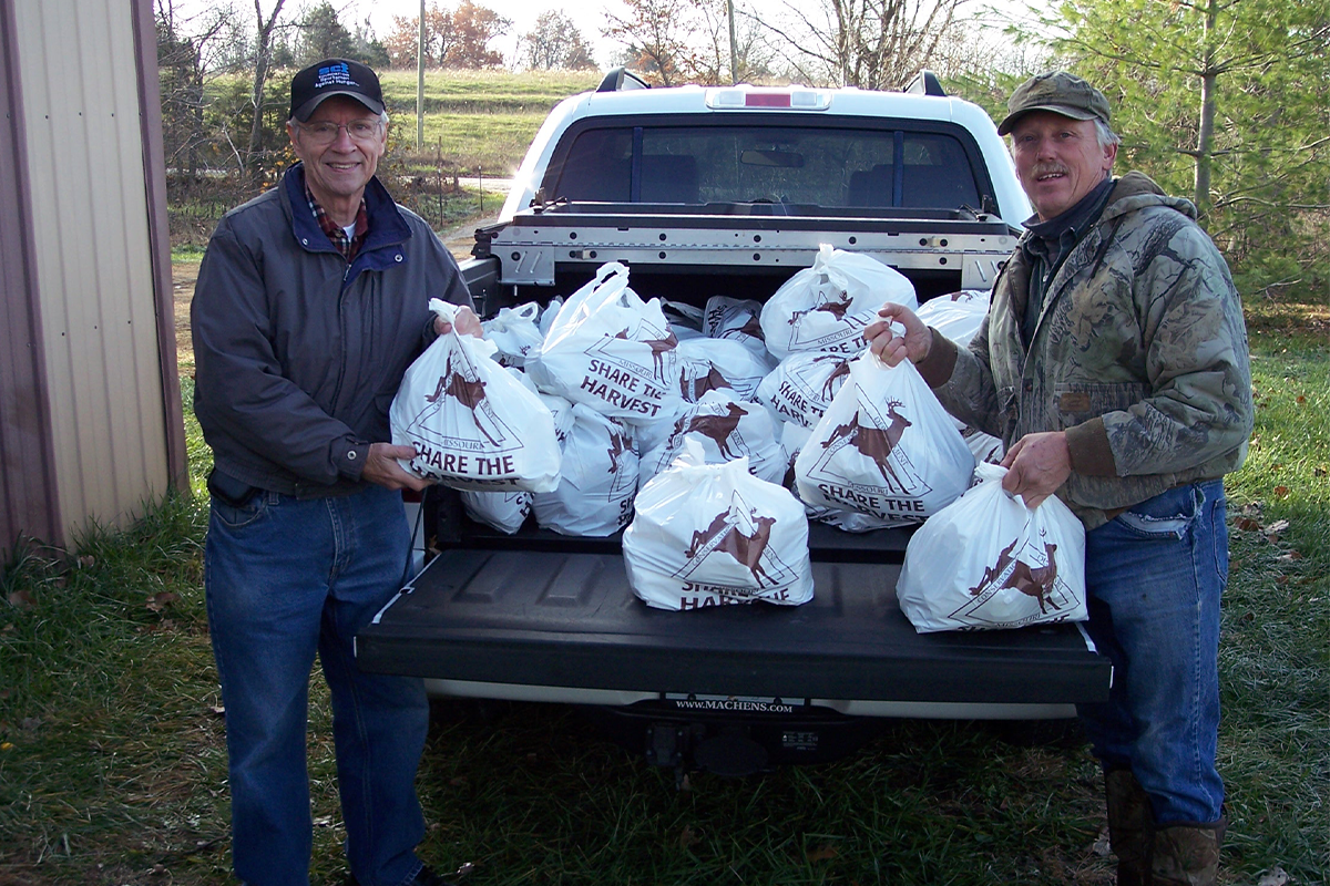 Volunteers distributing Share the Harvest products