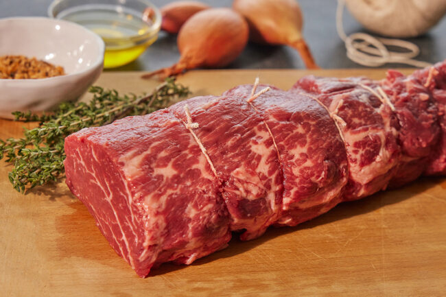 raw beef on a wooden table