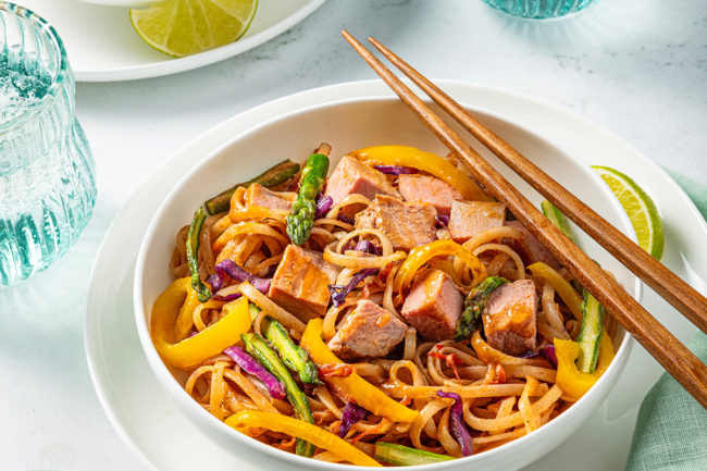 pork with veggie noodles in bowl