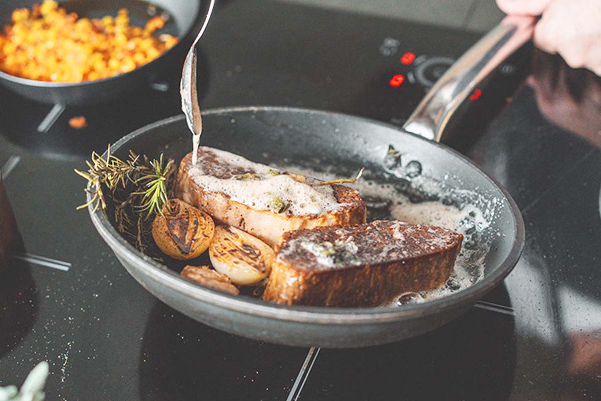 cultivated meat being prepared on the stovetop