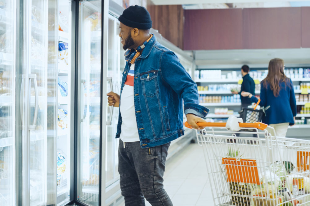 Grocery shopper in frozen food aisle