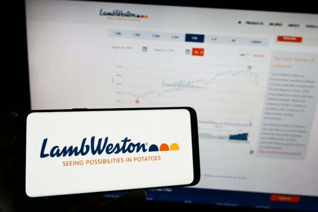 Lamb Weston logo on phone screen and computer screen in background