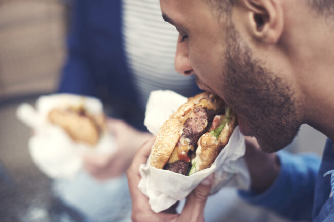 Man eating burger