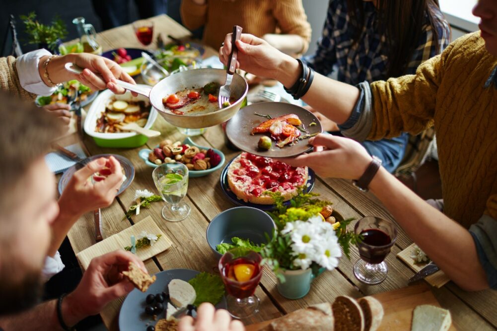 People sitting around table sharing a meal